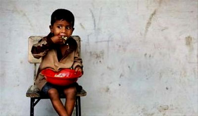 A young boy eats his lunch