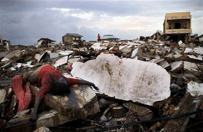 A dead womain amid the rubble of Banda Aceh, Indonesia