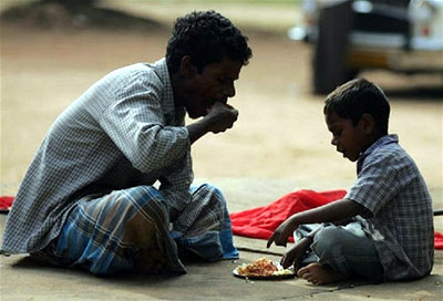 Two survivors: A father and his son share a meal