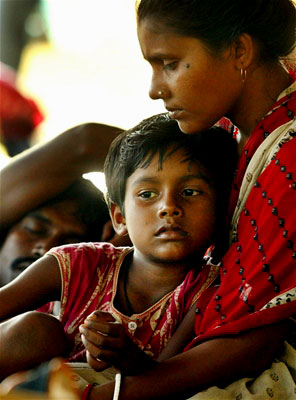 A woman holds her son