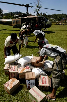 Villagers receive aid from the U.S. Navy