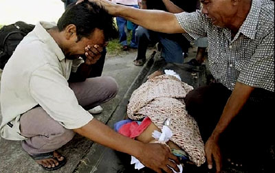 A man mourns the death of his daughter