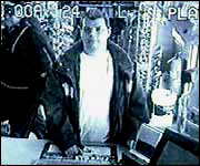 Timothy Barnes is caught on surveillance cameras stealing tsunami donation cans