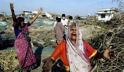 Two women mourn the loss of a family member